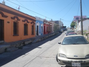 Colourful houses on a street in the hilly part of historical Maz.