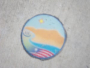 These little medallions appear several times in the sidewalks.