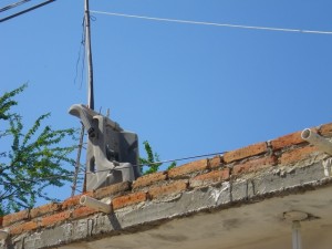 Another neighbour is using a child's car seat to hold up the clothes line on her roof!